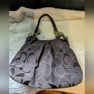Coach purse, approximately 13 inches in width and 10 inches in length.  Brown